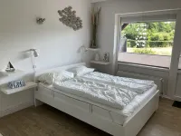 Spacious beach apartment in a quiet location with pool and sauna