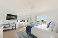 Tropical Elegance Meets Coastal Adventure at This Stunning Oceanfront Retreat!