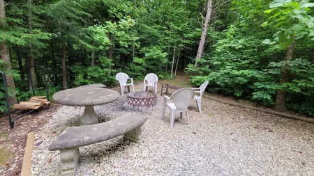 Secluded cozy cabin nestled among the hemlocks and rock formations in Hocking