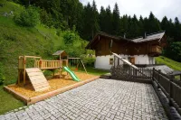 detached holiday house located forest edge, elevated above Großarl-Valley