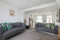 Just one row back from the beach; sea view; family & dog friendly