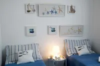 Mediterranean Beachfront Abode with Panoramic Terrace and Breathtaking Views