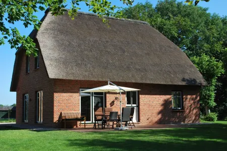 Cottage on park-like grounds with pond