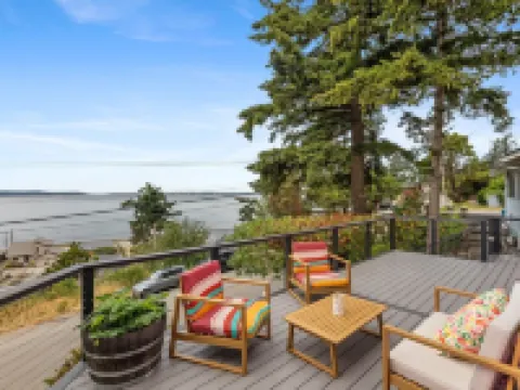 Darling pink beach house with epic views in a cozy community.