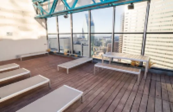 Cozy Retreat with Rooftop Pool, Parking, and Spacious Comfort