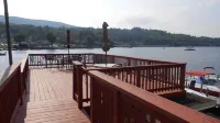 Winnipesaukee lakefront house includes slip, deck, hot tub & sleeps up to 11