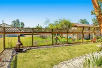 Contemporary dog-friendly home with backyard, patio, washer/dryer, pellet stove