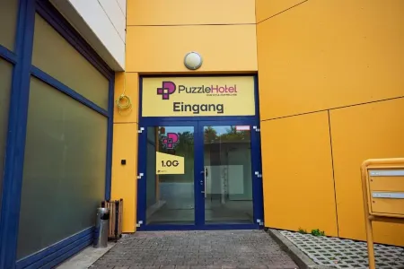 Puzzle Hotel Airport Frankfurt Отели в г. Бишофсхайм