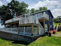 Relax by Lake of the Ozarks in your spacious Sunrise Beach retreat on 1 acre.