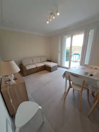 Apartment with balcony upstairs of a villa 300 m from the sea