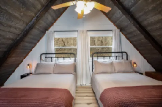 Modern Riverfront A-Frame Cabin w/ Hot Tub, Fire Pit, Kayaks, Canoe, & Arcade