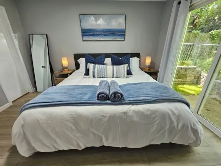 Cozy Home Near Downtown w/ Hot Tub, Fire Pit, Bikes, King Bed, and Full Kitchen