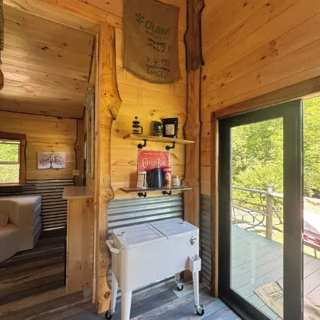 Tiny cabin sits by a bubbling, stocked creek. Pet friendly for a fee, hot tub