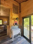 Tiny cabin sits by a bubbling, stocked creek. Pet friendly for a fee, hot tub