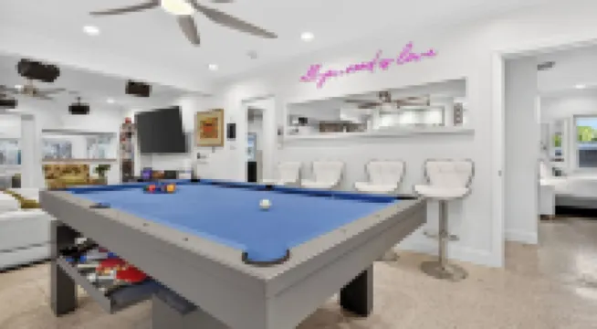 Swim Spa Retreat w/ Game Room, EV Charger, Near Las Olas Casa Pineapple Social by Avantstay
