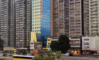 The city is surrounded by numerous tall buildings, including an office tower located in the center at Ibis Hong Kong North Point