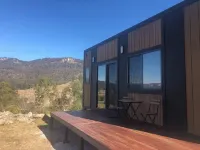 Modern cabin offering incredible views with fire pit, spa and hiking trails.