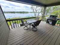 Spacious Lakehouse Getaway. Private Dock with large fenced Backyard and Gameroom