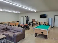 Lakefront secluded mult-family retreat with game room and two cabins.