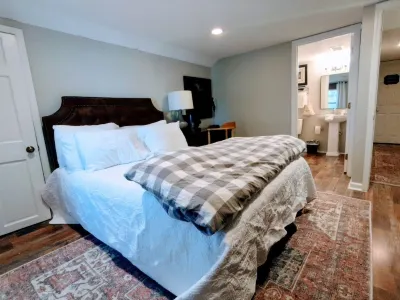 Private room with a queen bed at The Town House Inn