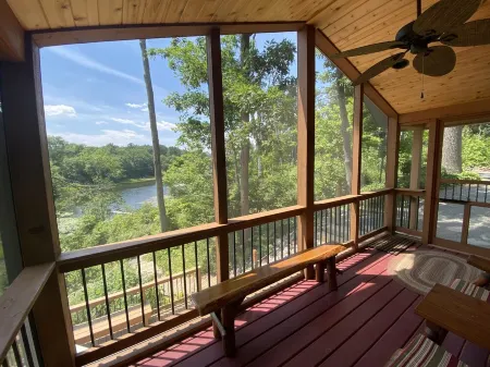 Secluded Waterfront Cabin on hiking trails! Lake on one side river on the other.