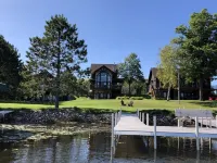 Bay Lake Cabin w/200ft of Lakefront, fun deck, private dock + woodfire sauna!