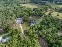 Luxurious 6-bedroom estate with pool, on over 6 fenced in acres