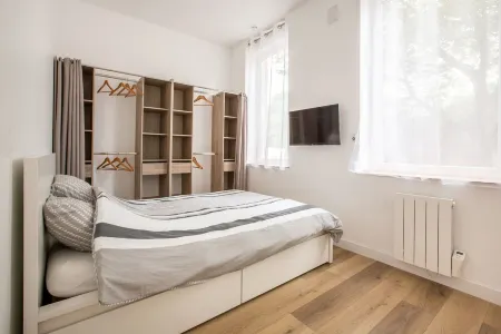Appartement Avec 3 Suites Parentales et Borne D'arcade!