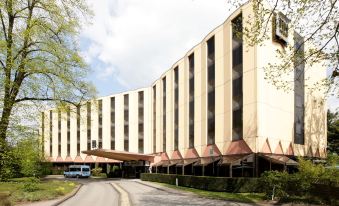 "a large building with a sign that says "" grand canyon national park "" is shown in the image" at NH Luxembourg