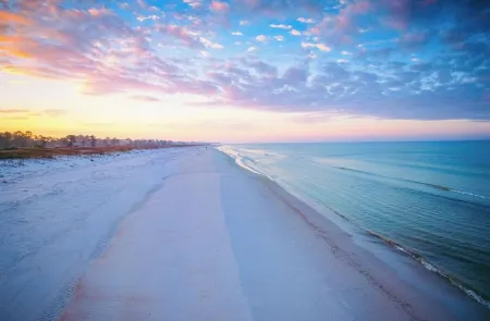 Enjoy sunset and an evening around firepit, short walk to beach and pool