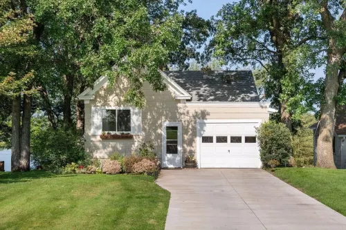 Lake home, across the street from a golf course & minutes to shopping and more!