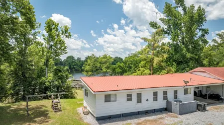TWO homes on Black River Lake with TWO boat slips!