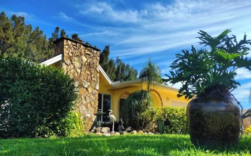 Spacious 5-bedroom Estate Home with a country club back porch pool & waterfall