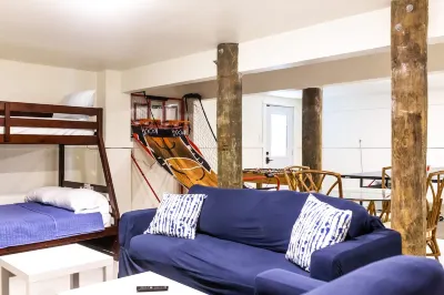 Community Pool and Distinct Living Spaces - Elegant Beach House Retreat