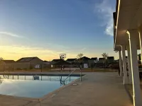 5 bedroom spacious home, with charcoal grill and seating. Peaceful neighborhood.