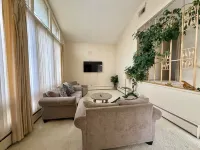 Cheerful 4-bedroom bungalow with indoor fireplace.