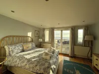 Out Of The Blue Is Situated In A Breathtaking Location Overlooking Croyde Beach. Hotels near Surfer's Paradise Croyde Bay Campsite