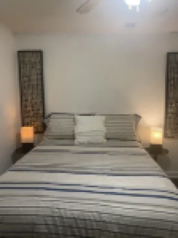 Cozy retreat half a mile away from the Beach set amidst peaceful tropical garden