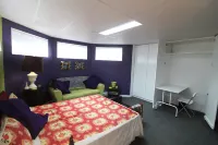 Gandhi: Very Large Room Decorated in Indian Style, Office Space and Sofa