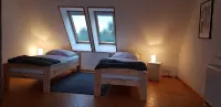 Holiday house with a large garden and swimming lake in the village