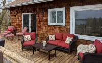 Enjoy elegant comfort with breathtaking water views on grand property