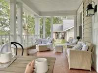 Designer Retreat in Quaint Historic District w Front Porch Dining under the oaks