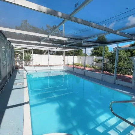 Quiet Pool Haven: 4BR - 9PPL, AC, WiFi, and Beaches Nearby
