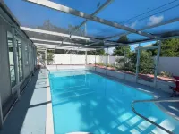 Quiet Pool Haven: 4BR - 9PPL, AC, WiFi, and Beaches Nearby