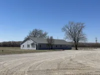 Large house surrounded by farm land along the Republican River.
