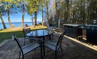 Waterfront gem, sandy beach, modern kitchen, large great room, free firewood