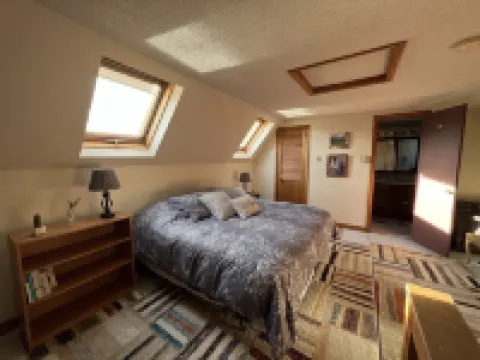 Home with a spring-fed pond and mountain view.