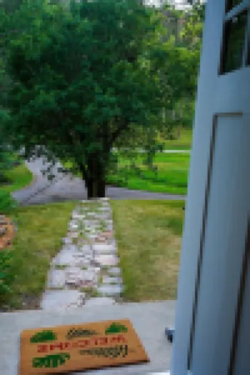 Remodeled home in the woods, just past city limits. With horse pasture nearby!