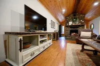 Secluded 4 bedroom farmhouse nestled on 8 acres with large lawn and oak trees.