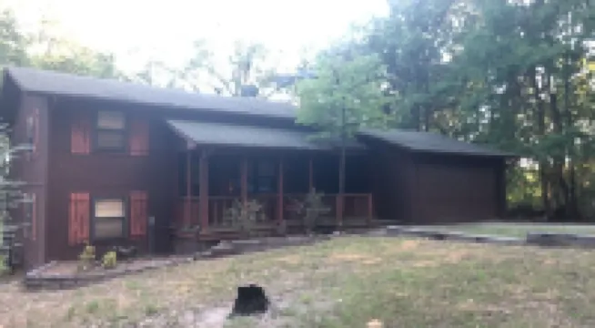 Private lakefront getaway with a sandy beach below the back deck!